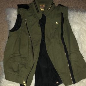 Olive green vest with faux leather detail